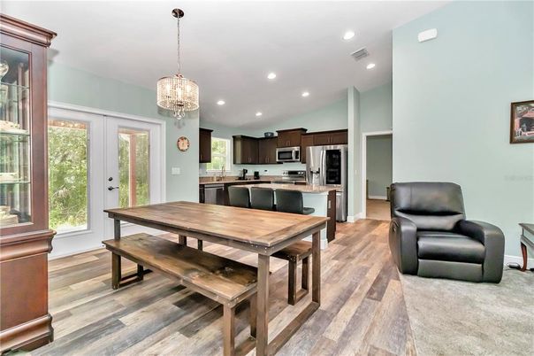Chandelier, Dining room, Interior, Kitchen, Recessed Lighting, Stainless Steel Appliances, Wood Texture Flooring