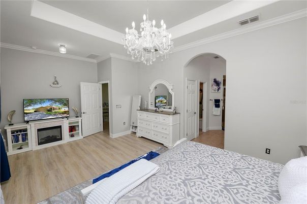 Bedroom, Chandelier, Fireplace, Interior, Wood Texture Flooring