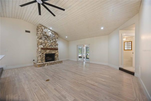 Empty room, Fireplace, Interior, Kitchen, Recessed Lighting, Wood Texture Flooring