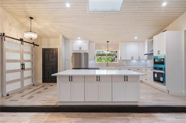 Interior, Kitchen, Pendant Lights, Recessed Lighting, Stainless Steel Appliances, Wood Texture Flooring