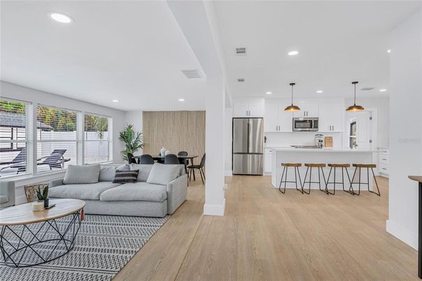 Dining room, Interior, Kitchen, Living room, Pendant Lights, Recessed Lighting, Stainless Steel Appliances, Wood Texture Flooring