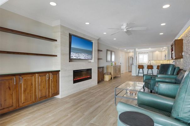 Dining room, Fireplace, Interior, Living room, Recessed Lighting, Wood Texture Flooring