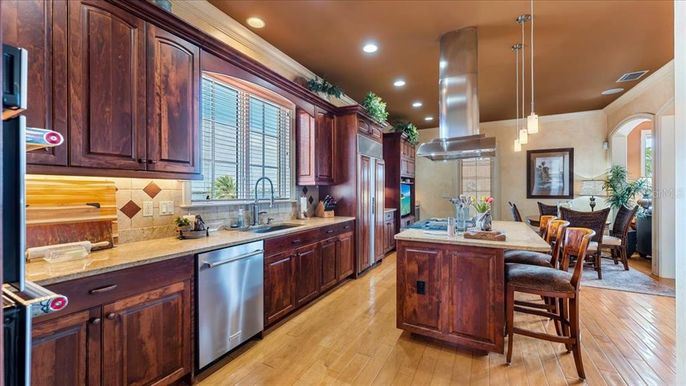 Dining room, Interior, Kitchen, Pendant Lights, Recessed Lighting, Stainless Steel Appliances, Wood Texture Flooring