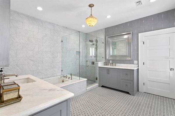 Bathroom, Dual Sink Vanities, Glass Shower, Interior, Marble Walls, Recessed Lighting