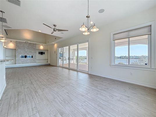 Empty room, Fireplace, Interior, Pendant Lights, Recessed Lighting, Stone Walls, Wood Texture Flooring