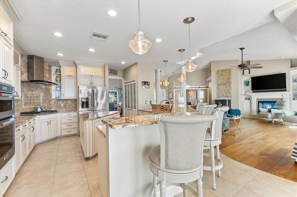 Dining room, Fireplace, Interior, Kitchen, Living room, Pendant Lights, Recessed Lighting, Stainless Steel Appliances, Wood Texture Flooring