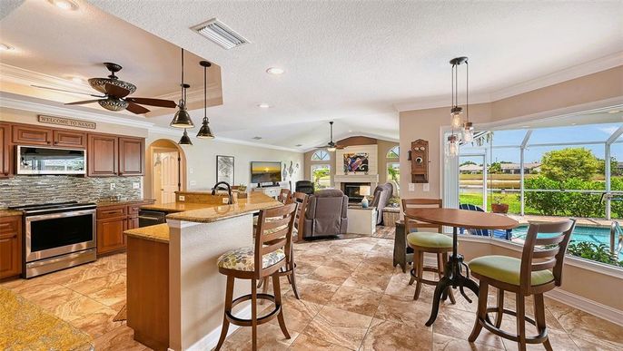 Dining room, Fireplace, Glass Ceilings, Interior, Kitchen, Living room, Pendant Lights, Recessed Lighting, Stainless Steel Appliances, Sun Room