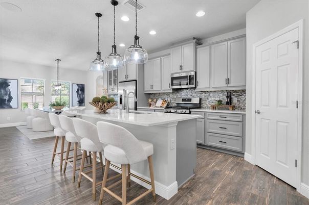 Dining room, Interior, Kitchen, Pendant Lights, Recessed Lighting, Stainless Steel Appliances, Wood Texture Flooring