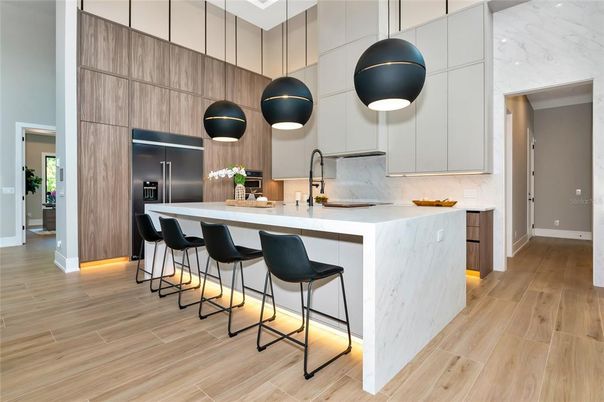 Interior, Kitchen, Marble Walls, Pendant Lights, Stainless Steel Appliances, Wood Texture Flooring