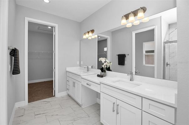 Bathroom, Dual Sink Vanities, Interior, Marble, Recessed Lighting, Walk-in Closets