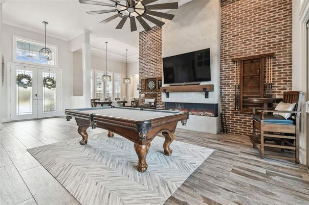 Billiard Table, Fireplace, Game Room, Interior, Pendant Lights, Stone Walls, Wood Texture Flooring