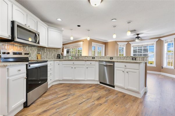 Interior, Kitchen, Pendant Lights, Recessed Lighting, Stainless Steel Appliances, Wood Texture Flooring