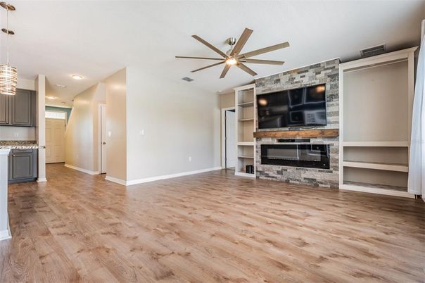 Empty room, Fireplace, Interior, Pendant Lights, Recessed Lighting, Wood Texture Flooring