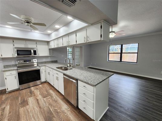 Interior, Kitchen, Recessed Lighting, Stainless Steel Appliances, Wood Texture Flooring