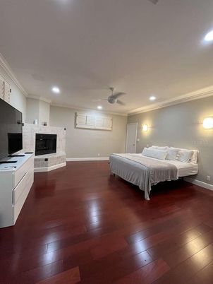 Bedroom, Fireplace, Interior, Recessed Lighting, Wood Texture Flooring