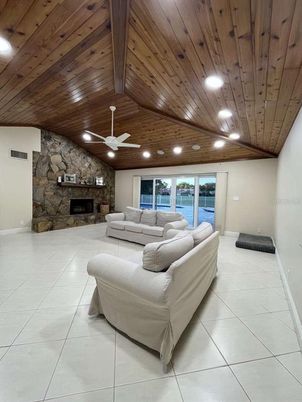 Fireplace, Interior, Living room, Recessed Lighting, Stone Walls, Wooden Ceilings