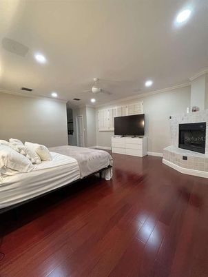 Bedroom, Fireplace, Interior, Recessed Lighting, Wood Texture Flooring