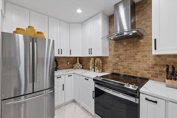 Interior, Kitchen, Marble, Recessed Lighting, Stainless Steel Appliances, Stone Walls