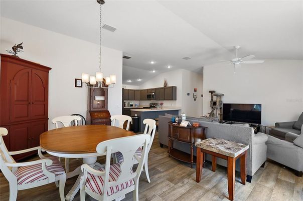 Chandelier, Dining room, Interior, Kitchen, Living room, Pendant Lights, Recessed Lighting, Wood Texture Flooring