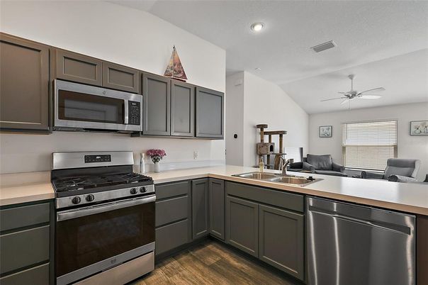 Dining room, Interior, Kitchen, Recessed Lighting, Stainless Steel Appliances, Wood Texture Flooring