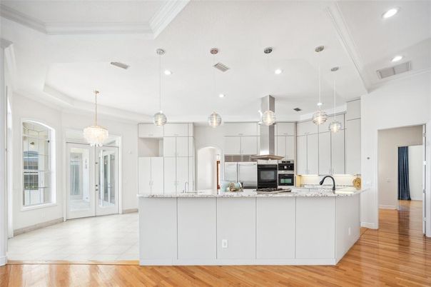 Chandelier, Interior, Kitchen, Pendant Lights, Recessed Lighting, Stainless Steel Appliances, Wood Texture Flooring