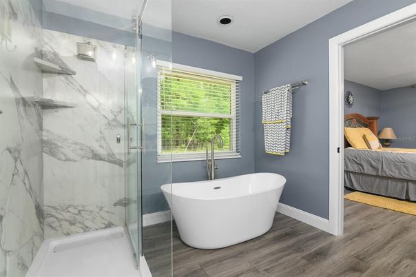 Bathroom, Bedroom, Free Standing Baths, Glass Shower, Interior, Marble Walls, Wood Texture Flooring