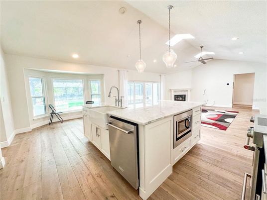 Fireplace, Interior, Kitchen, Pendant Lights, Recessed Lighting, Stainless Steel Appliances, Wood Texture Flooring