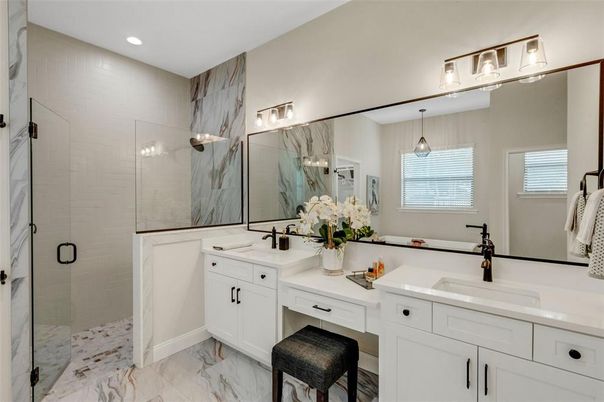 Bathroom, Dual Sink Vanities, Glass Shower, Interior, Marble, Marble Walls, Pendant Lights, Recessed Lighting