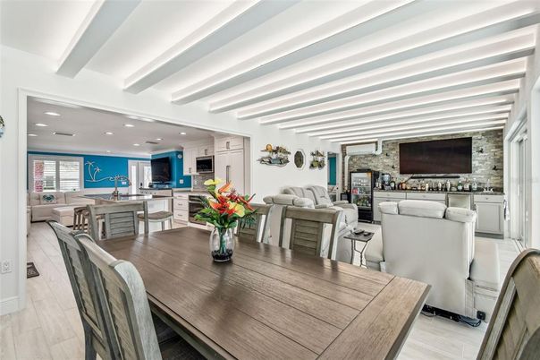 Dining room, Interior, Kitchen, Living room, Recessed Lighting, Stainless Steel Appliances, Stone Walls, Wood Texture Flooring