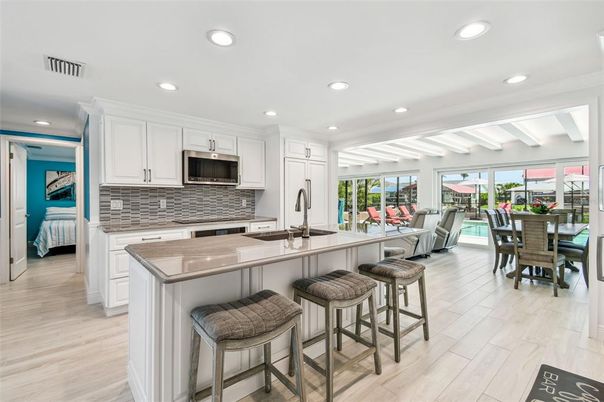 Dining room, Interior, Kitchen, Recessed Lighting, Stainless Steel Appliances, Wood Texture Flooring
