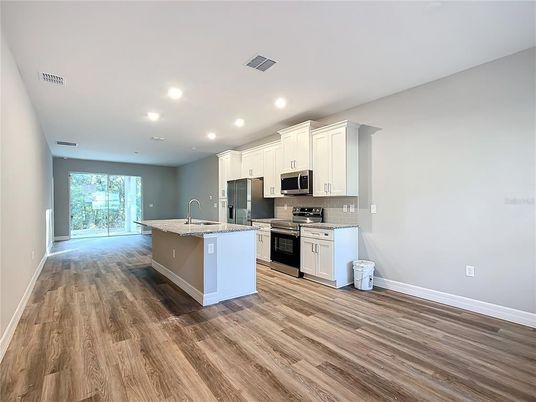 Interior, Kitchen, Recessed Lighting, Stainless Steel Appliances, Wood Texture Flooring