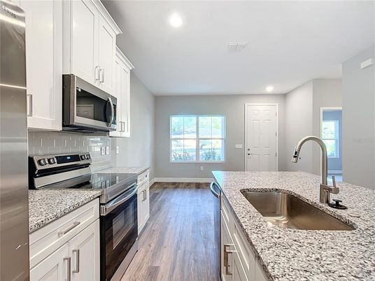 Interior, Kitchen, Recessed Lighting, Stainless Steel Appliances, Wood Texture Flooring