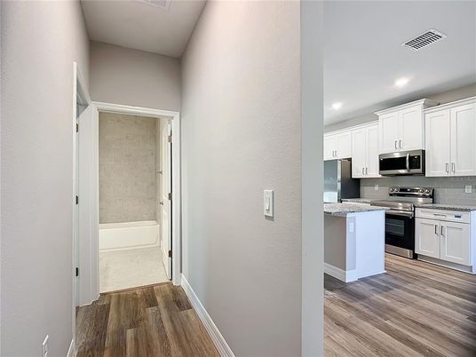 Interior, Kitchen, Recessed Lighting, Stainless Steel Appliances, Wood Texture Flooring