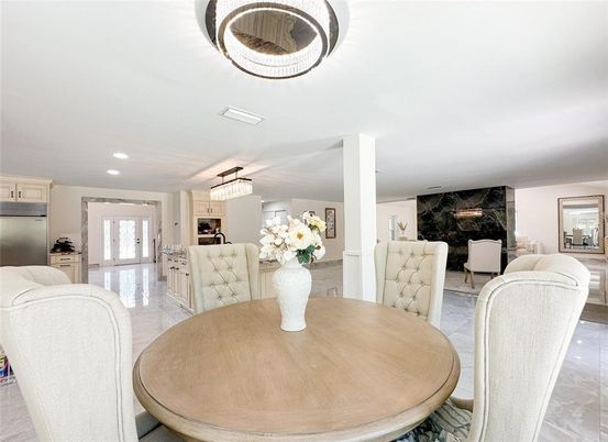 Chandelier, Dining room, Fireplace, Interior, Kitchen, Pendant Lights, Recessed Lighting, Stainless Steel Appliances