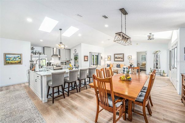 Dining room, Interior, Kitchen, Pendant Lights, Recessed Lighting, Stainless Steel Appliances, Wood Texture Flooring