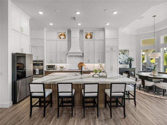 Dining room, Interior, Kitchen, Pendant Lights, Recessed Lighting, Stainless Steel Appliances, Wood Texture Flooring