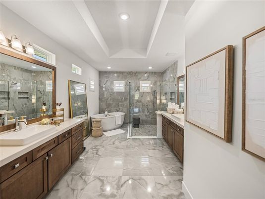 Bathroom, Dual Sink Vanities, Free Standing Baths, Glass Shower, Interior, Marble, Marble Walls, Recessed Lighting