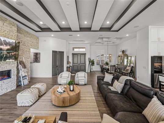Dining room, Fireplace, Interior, Living room, Pendant Lights, Recessed Lighting, Stone Walls, Wood Texture Flooring