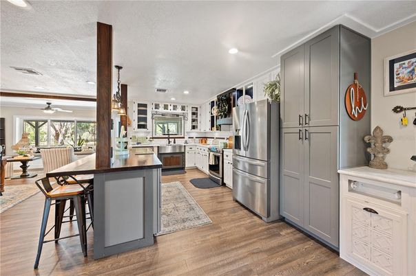 Dining room, Interior, Kitchen, Pendant Lights, Recessed Lighting, Stainless Steel Appliances, Wood Texture Flooring