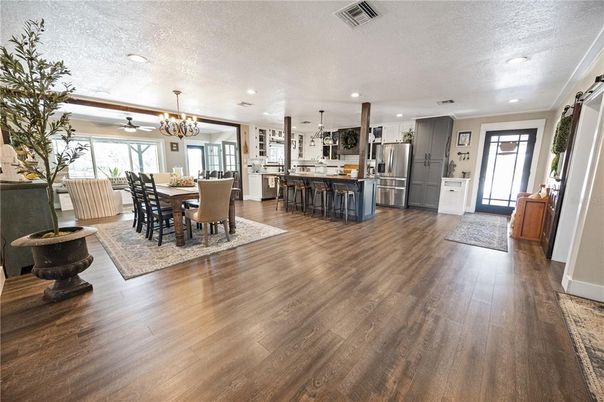 Chandelier, Dining room, Interior, Kitchen, Pendant Lights, Recessed Lighting, Stainless Steel Appliances, Wood Texture Flooring