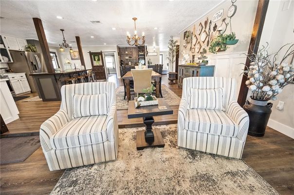 Chandelier, Dining room, Interior, Kitchen, Living room, Pendant Lights, Recessed Lighting, Stainless Steel Appliances, Wood Texture Flooring