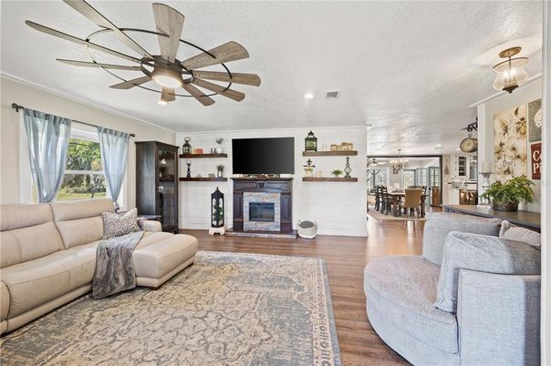 Dining room, Fireplace, Interior, Living room, Recessed Lighting, Wood Texture Flooring