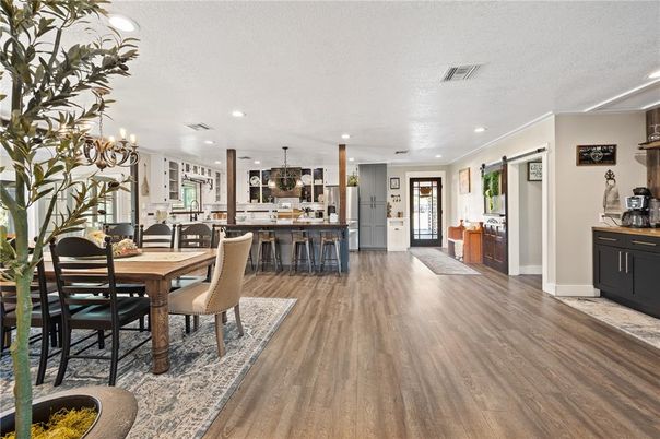 Dining room, Interior, Kitchen, Pendant Lights, Recessed Lighting, Stainless Steel Appliances, Wood Texture Flooring