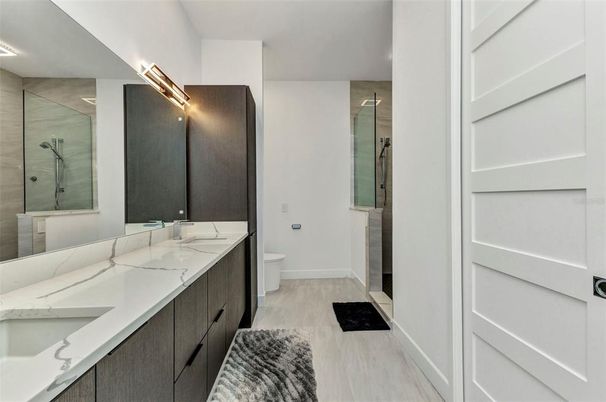 Bathroom, Dual Sink Vanities, Glass Shower, Interior, Wood Texture Flooring