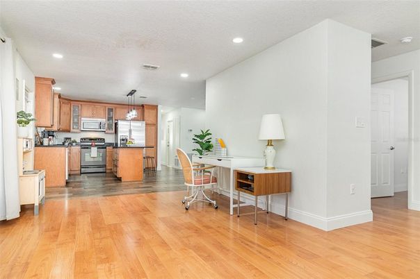Dining room, Interior, Kitchen, Pendant Lights, Recessed Lighting, Stainless Steel Appliances, Wood Texture Flooring