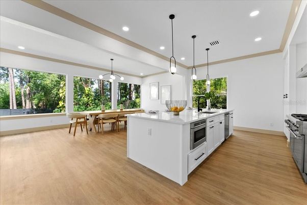 Dining room, Interior, Kitchen, Pendant Lights, Recessed Lighting, Stainless Steel Appliances, Wood Texture Flooring