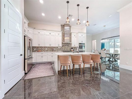 Chandelier, Dining room, Interior, Kitchen, Pendant Lights, Recessed Lighting, Stainless Steel Appliances