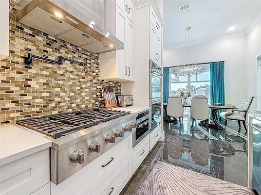 Dining room, Interior, Kitchen, Pendant Lights, Recessed Lighting, Stainless Steel Appliances, Stone Walls