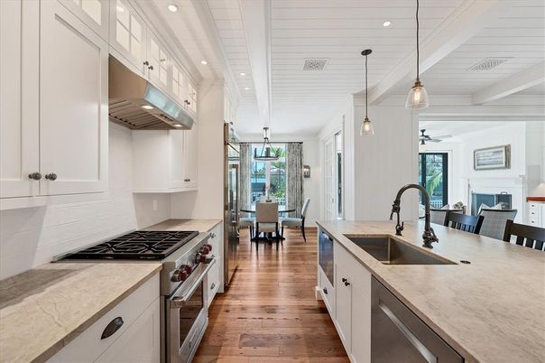 Dining room, Fireplace, Interior, Kitchen, Pendant Lights, Recessed Lighting, Stainless Steel Appliances, Wood Texture Flooring