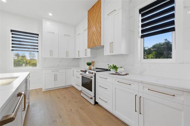 Interior, Kitchen, Marble Walls, Recessed Lighting, Stainless Steel Appliances, Wood Texture Flooring